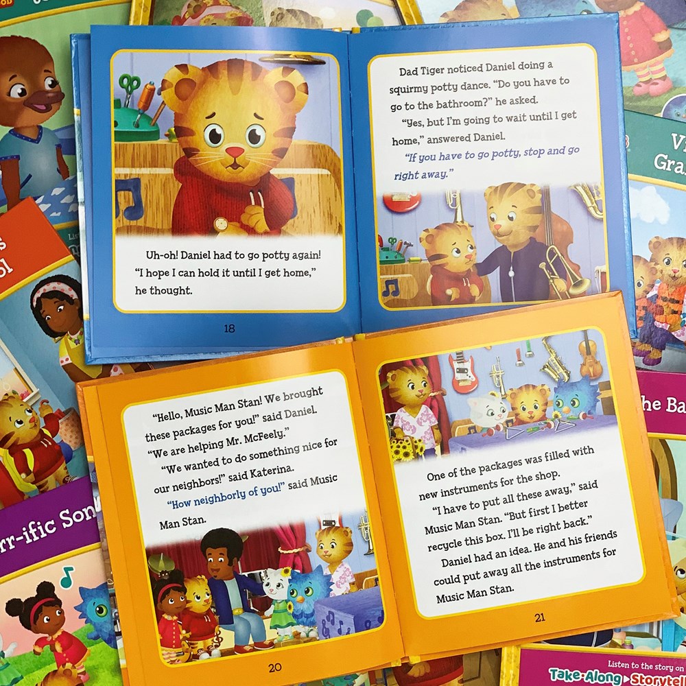 Daniel Tiger's Neighborhood Interactive Electronic Take Along Storyteller with 11 books (Daniel Tiger's Neighborhood Children's Interactive Story and Song Carry Along Player With Books)